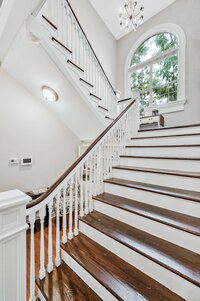 Classic historic staircase in vacation rental home in downtown Waco, TX