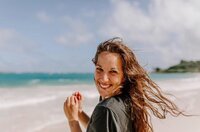 girl posing and smiling in field