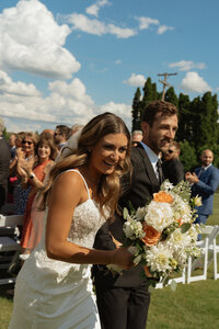 bride and groom walking back down the aisle