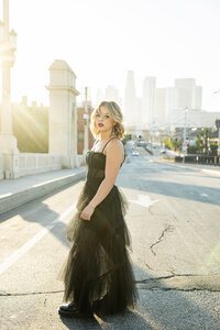 Senior pictures in Los Angeles featuring editorial posing, natural light, and bold city styling.

