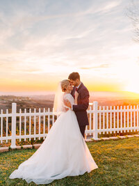 sunset wedding couple photography  with orange and yellow setting sun