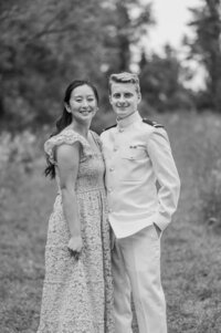 A couple with their arms around each other smiling