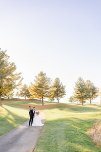 Ballroom wedding reception with green and gold