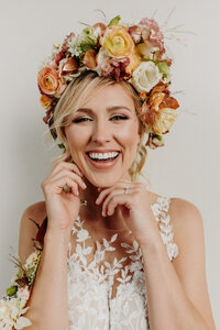 bride headshot smiling at the camera