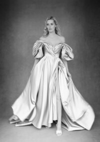 Black and white portrait of a bride in an elegant gown