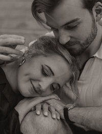 A young couple taking couples photos at Boom Island in Minneapolis