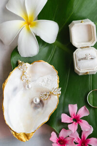 Beachfront wedding ceremony setup with white floral circle arch in Marco Island