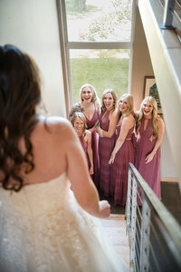 A bride greets her happy bridesmaids in Whitefish Montana.