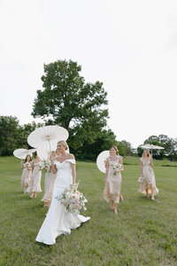  Bride walking gracefully outdoors, captured in timeless Clar Barron Photo style.