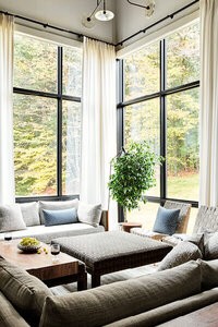 Boston interior decorator transforms a sparse new build in Stowe, Vermont, into a comfortable and chic ski house with warm layers and modern mountain style. 