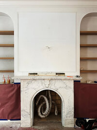 Full renovation featuring salvaged marble fireplaces, custom millwork, and modern elements alongside traditional architectural details.