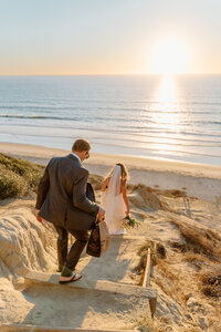 bride and groom on cliff