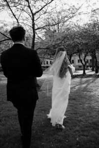 black and white overlay of bride and groom sharing happy moment, bride holding groom's face, candid wedding photography, super 8 wedding film