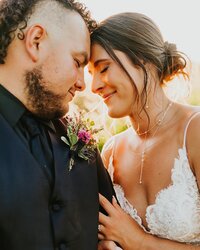 Wedding photographer in Rexburg Idaho Adriana Montoya Photo. A bride and groom touch foreheads. She has her hand on his chest, and both have soft smiles with their eyes closed.