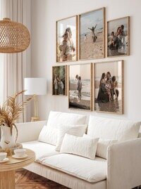 Wall gallery display of family portraits at home by Michigan photographers