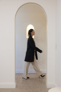 Cosmetic Nurse walking into treatment room to do lip fillers in newcastle NSW