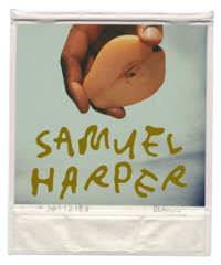 Hand holding a half pear with a logo for Samuel Harper