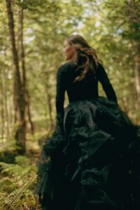 holistic health educator - elizabeth walking in black dress