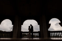 Couple enjoys a moment alone at Villa Antonia, one of Austin’s best wedding venues.