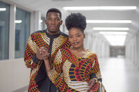 a couple wearing traditional african attire standing close and holding hands. Captured by Amanda Jordan Photography.
