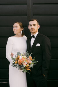 modern hipster photos of bride and groom standing side by side