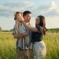 A photo of Cindy and her family in a field of wildflowers.