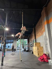 Toni climbing the rope at her gym CrossFit Cheyenne