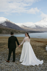 A couple walking around Eklutna Lake.