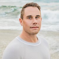 A professional headshot of Chris Hill, the talented brand photographer who collaborates with Unica Formo to capture high-quality visuals for client websites.