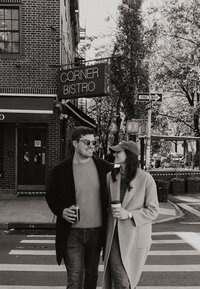 A couple walking down the street of New York together 