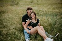 couple sitting in grass field, couples photographer in texas panahndle