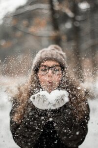 woman-blowing-snow-outdoors-2254028