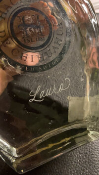 Close up of engraved liquor bottle