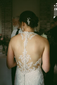 photo of the back of a lace wedding dress