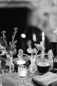 Black and white photo of reception table.