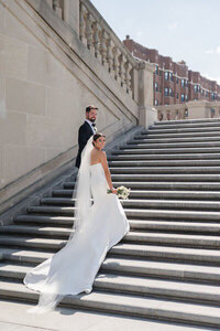 Cincinnati wedding photographer capturing bride and groom walking up stairs
