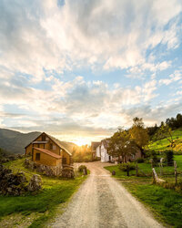 Idyllic countryside villa surrounded by open fields and nature.