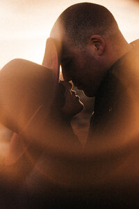 A creative portrait of a couple inside a "ring of fire" during their Las Vegas Elopement in Valley of Fire  State Park.