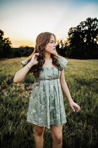 senior girl in a field in flowermound texas