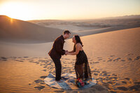 bride and groom eloping in sand dunes