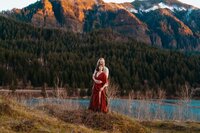 a couple embracing with the mountains in the background
