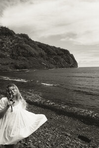a virginia wedding photographer posing with her 35mm film camera