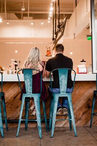 Newlyweds get celebratory ice cream after elopement in Murfreesboro, sitting at the soda fountain