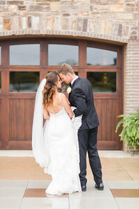 textured wedding bouquet with greens, whites, and purples at oaks lakeside wedding