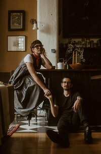 man and woman get cozy in their boston apartment