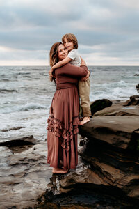 Mother embraces her son during family photoshoot in Charleston, SC.