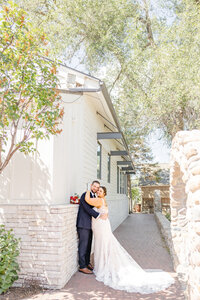 Recently married couple poses for stunning portrait at Gardner village in West Jordan Utah