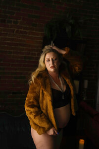 Client wearing her grandmas vintage fur coat session captured in our Nashville boudoir studio