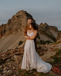 groom hugging bride