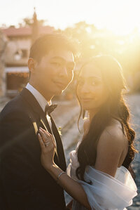 Newlyweds standing close together at sunset, their expressions tender and calm — timeless fine-art wedding portrait captured by Asia Pimentel at Altos de Chavón.